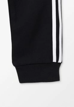 Adidas Originals TREFOIL - Tracksuit Bottoms - Black/white -Adidas Originals Shop 05f8c4252e114fc484a009ab805ffd2a