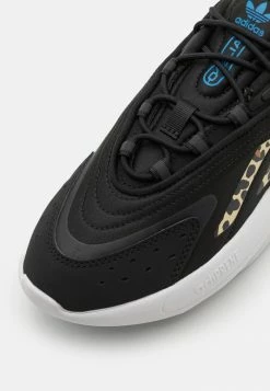 Adidas Originals OZELIA UNISEX - Trainers - Core Black/footwear White/blue -Adidas Originals Shop 14a0e3bcbe8e4f03af8c3fbe0669da78