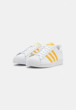 Adidas Originals SUPERSTAR UNISEX - Trainers - Footwear White/team Colleg Gold/pulse Blue 7 Adidas Originals SUPERSTAR UNISEX - Trainers - Footwear White/team Colleg Gold/pulse Blue -Adidas Originals Shop 15768d8de2db454faf2c97786e6a8cb4