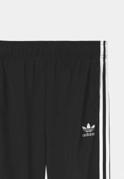 Adidas Originals TRACK PANTS UNISEX - Tracksuit Bottoms - Black/white -Adidas Originals Shop 290b6d0364bc4cd9901e48002cd523a8