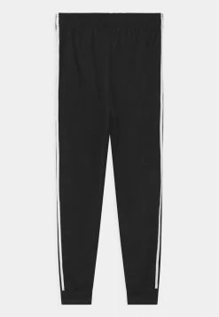 Adidas Originals TRACK PANTS UNISEX - Tracksuit Bottoms - Black/white -Adidas Originals Shop 2ff9cdb4397c4aa1ac9de9a5e57b8295