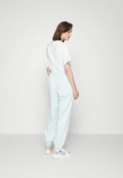 Adidas Originals RELAXED - Tracksuit Bottoms - Almost Blue -Adidas Originals Shop 30f3ea6429ea43258b4368ce8269f44e