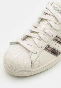 Adidas Originals SUPERSTAR KALEIDOSCOPE DREAM UNISEX - Trainers - Off White/core Black/gold Metallic -Adidas Originals Shop 36297037f1cc41269f0bc7af30ef228d