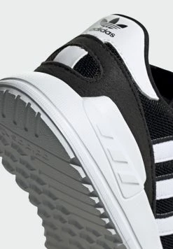 Adidas Originals TRAINER LITE UNISEX - Trainers - Core Black/ftwr White/core Black -Adidas Originals Shop 3f344b8c67aa40a3afb340445e4e2a7a