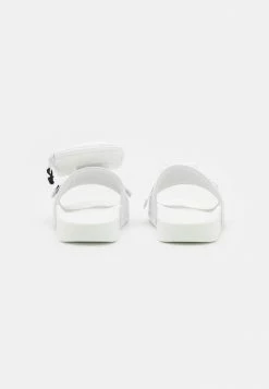 Adidas Originals POUCHYLETTE - Mules - Footwear White/core Black -Adidas Originals Shop 4d60a63fca8c496e9e7af507bc6f43bd