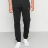 Adidas Originals ESSENT PANTS - Tracksuit Bottoms - Black