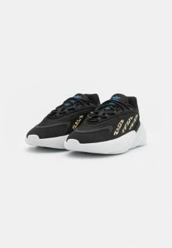 Adidas Originals OZELIA UNISEX - Trainers - Core Black/footwear White/blue -Adidas Originals Shop 525f68ee5784418cb4c19180c29a4eff