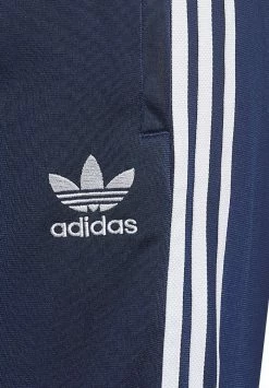 Adidas Originals TRACK PANTS UNISEX - Tracksuit Bottoms - Night Indigo -Adidas Originals Shop 5c26500ad21a49ec86fd2ab7d9825e07