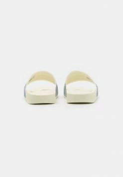 Adidas Originals ADILETTE UNISEX - Mules - Off White/altered Blue -Adidas Originals Shop 64a678b269974540ba9e1a4cbff22fbe