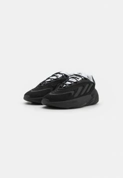 Adidas Originals OZELIA UNISEX - Trainers - Core Black/footwear White -Adidas Originals Shop 69c67d70a1f74c00819cb8b2cef378e9