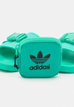 Adidas Originals POUCHYLETTE - Mules - Hi-res Green/core Black -Adidas Originals Shop 76049ca1ffcc495aad845446c4c9ab1b