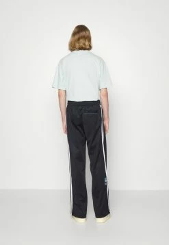 Adidas Originals TRACK PANTS UNISEX - Tracksuit Bottoms - Black -Adidas Originals Shop 7aad9d1e784e4ed3a5c012c8c1a551c6