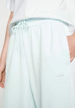 Adidas Originals RELAXED - Tracksuit Bottoms - Almost Blue -Adidas Originals Shop 7c0ba46fcd6e4f8297119818102d13ad