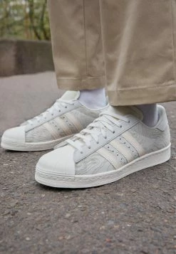 Adidas Originals SUPERSTAR 82 UNISEX - Trainers - Crystal White/ecru Tint/offwhite 10 Adidas Originals SUPERSTAR 82 UNISEX - Trainers - Crystal White/ecru Tint/offwhite -Adidas Originals Shop 7e06c0f574544493ad01efe0ea3f8bc5