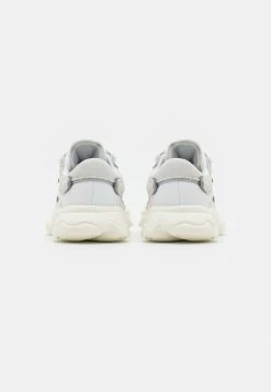 Adidas Originals OZWEEGO UNISEX - Trainers - Crystal White/footwear White/offwhite -Adidas Originals Shop 862881c3def540499137699456614077