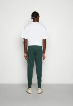 Adidas Originals 3-STRIPES PANT UNISEX - Tracksuit Bottoms - Mineral Green -Adidas Originals Shop 90ae2e2aeb95428788adff00713110fc