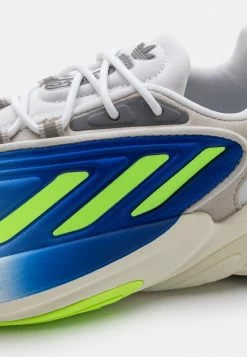 Adidas Originals OZELIA UNISEX - Trainers - Footwear White/signal Green/offwhite -Adidas Originals Shop 93d2c0df7def47988b8afa4d62bc4f8f