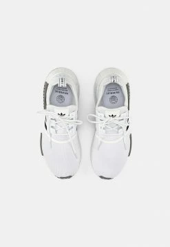 Adidas Originals NMD R1 PRIMEBLUE UNISEX - Trainers - White/core Black/grey Three -Adidas Originals Shop 9a8d79ea424d47caa16a941a0c72f23f