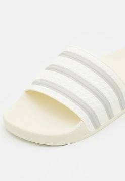 Adidas Originals ADILETTE UNISEX - Mules - Off White/grey One -Adidas Originals Shop 9eb7d86f99c94482b99586b303fa07fd