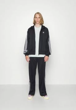 Adidas Originals TRACK PANTS UNISEX - Tracksuit Bottoms - Black -Adidas Originals Shop a0b1c3850b634d35aae75e2f77ce0395