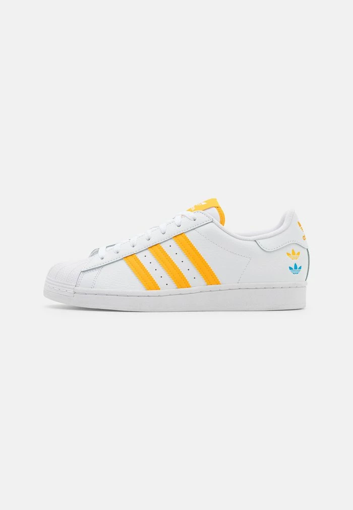 Adidas Originals SUPERSTAR UNISEX - Trainers - Footwear White/team Colleg Gold/pulse Blue 1 Adidas Originals SUPERSTAR UNISEX - Trainers - Footwear White/team Colleg Gold/pulse Blue