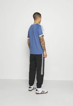 Adidas Originals LOCK UP UNISEX - Tracksuit Bottoms - Black -Adidas Originals Shop c3ad0e78deee4514913bc9e4526412b2