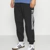 Adidas Originals LOCK UP UNISEX - Tracksuit Bottoms - Black