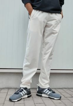 Adidas Originals STRAIGHT - Tracksuit Bottoms - Off-white -Adidas Originals Shop f3240415c8314c3e85fdce135390b98f