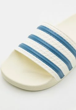 Adidas Originals ADILETTE UNISEX - Mules - Off White/altered Blue -Adidas Originals Shop fd87143b3a224de08e588a62f0467ab3